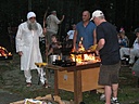 My friend Pat cooking on my homemade Cajun Microwave, Todd playing one of his parts.