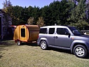I pulled it with a 2011 Honda Element. It had no problem porn in the mountains.